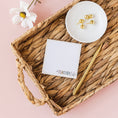 Load image into Gallery viewer, a basket with a notepad, pen, and flower on it