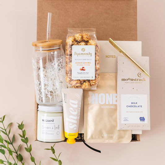 a box of food and a cup of coffee