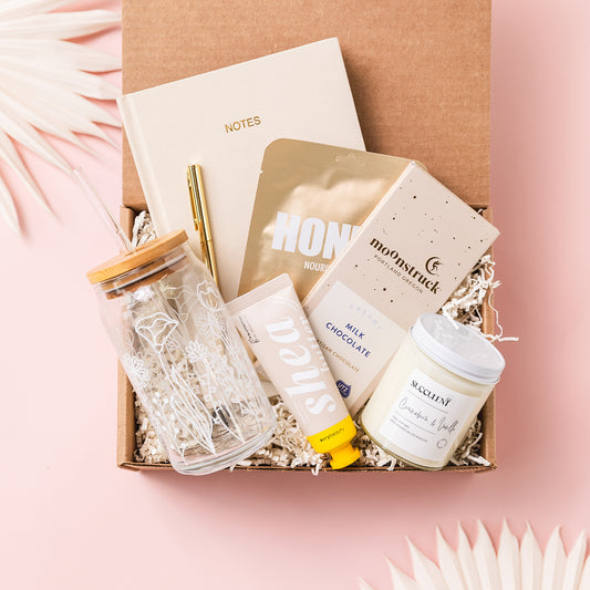 a box of personal care items on a pink background