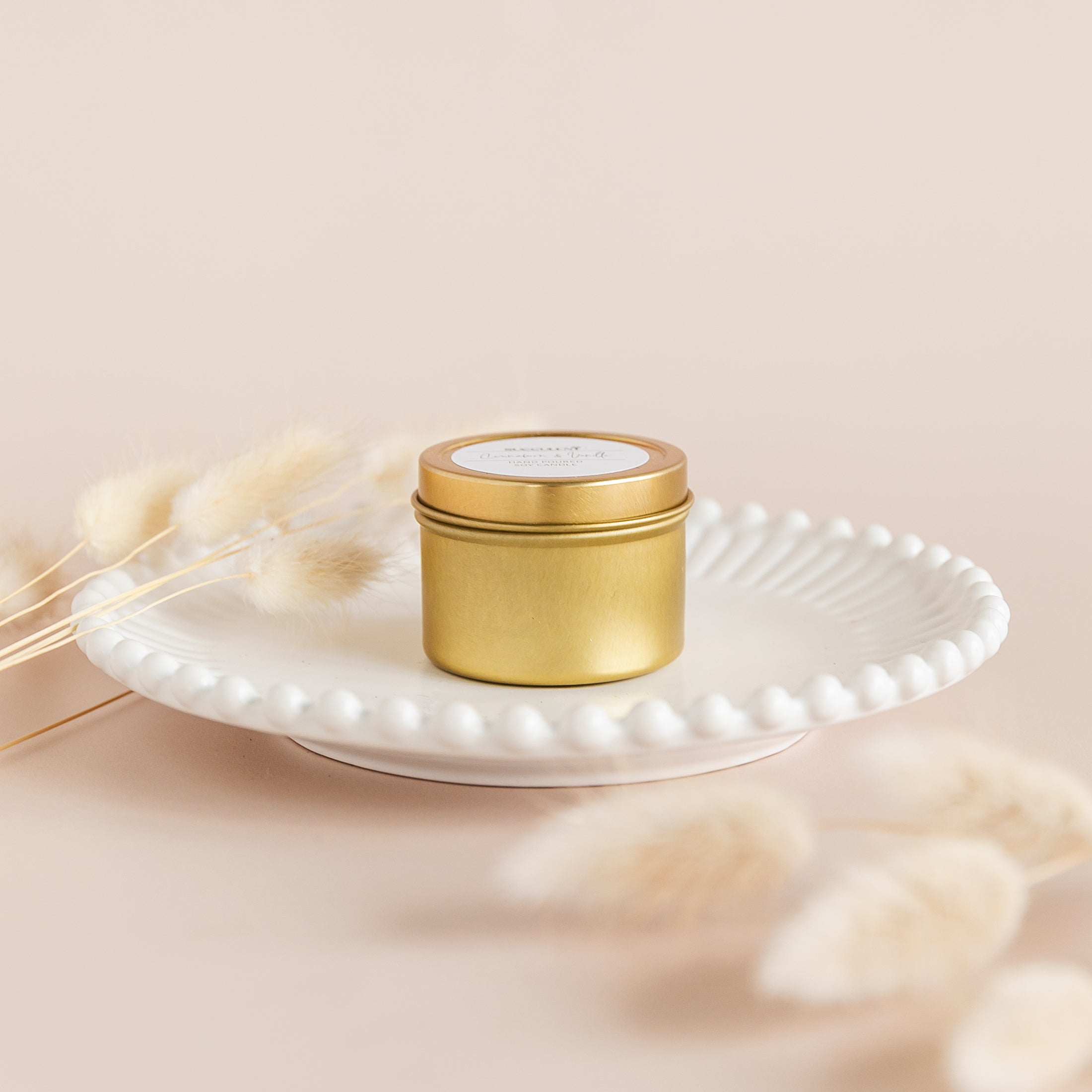 a white plate topped with a small jar of cream