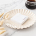 Load image into Gallery viewer, a paper plate with a business card on it next to a cup of coffee
