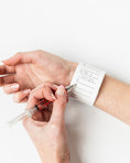 Load image into Gallery viewer, a woman is holding a sy in her hand
